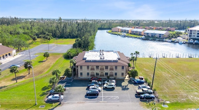 birds eye view of property with a water view