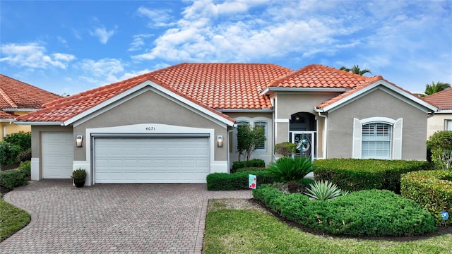 mediterranean / spanish-style house featuring a garage