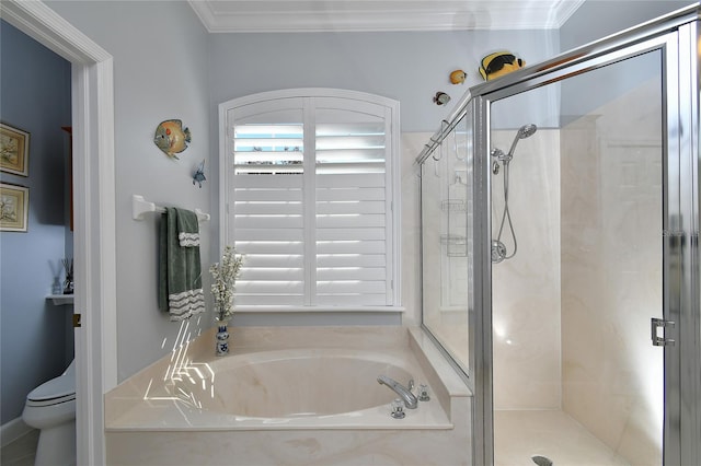 bathroom featuring toilet, ornamental molding, and plus walk in shower