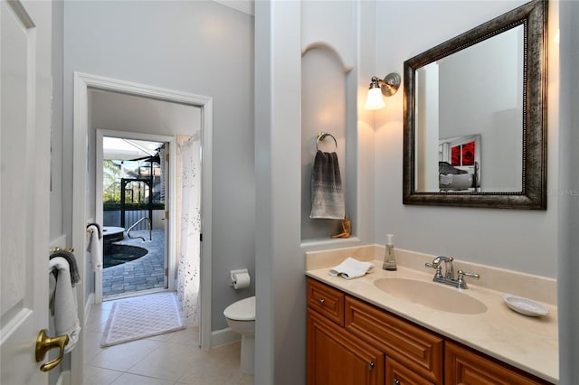 bathroom featuring tile patterned floors, vanity, and toilet