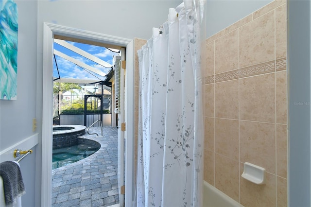 bathroom featuring shower / bathtub combination with curtain