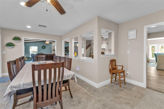 dining room with a ceiling fan, recessed lighting, visible vents, and baseboards