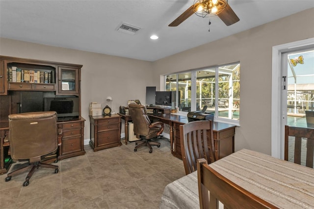 office featuring recessed lighting, visible vents, baseboards, and a ceiling fan