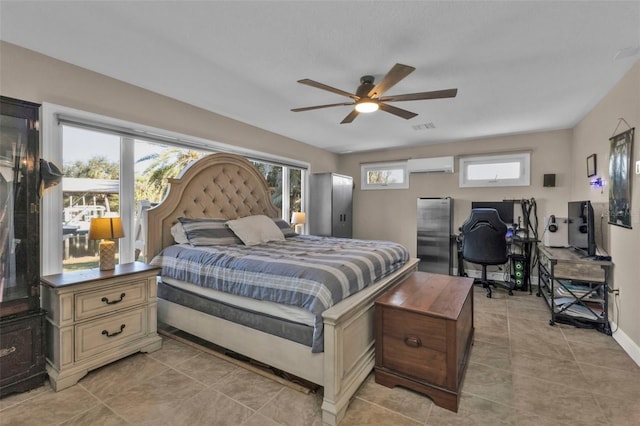 bedroom featuring visible vents, multiple windows, an AC wall unit, and baseboards