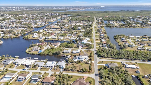 bird's eye view with a residential view and a water view