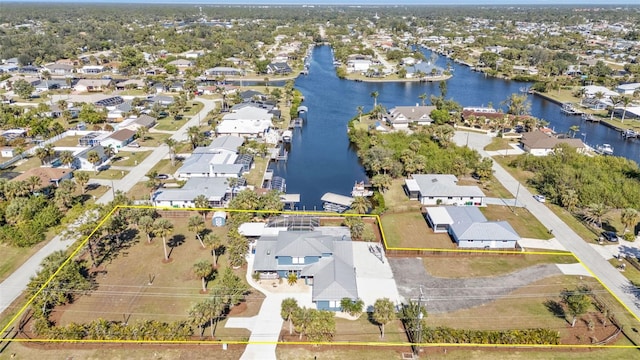 birds eye view of property with a residential view and a water view