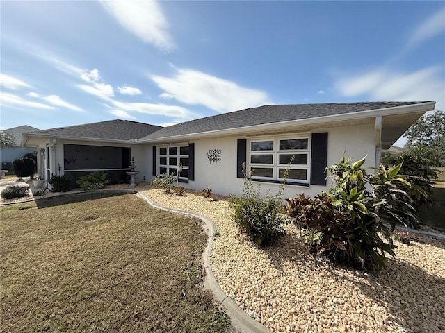 ranch-style home with a front yard