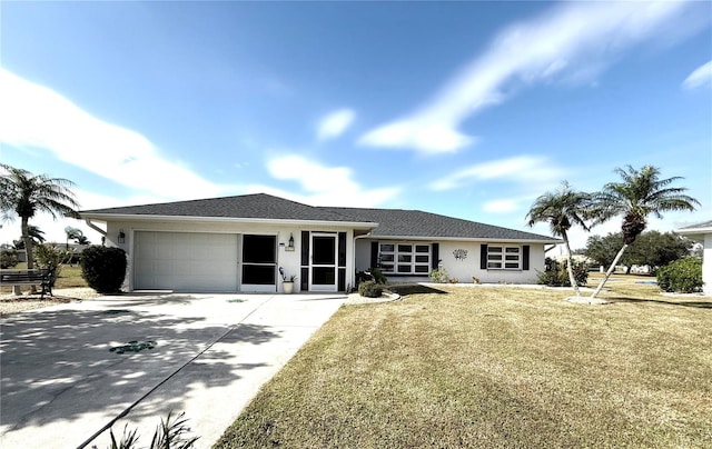 ranch-style home featuring a garage and a front yard