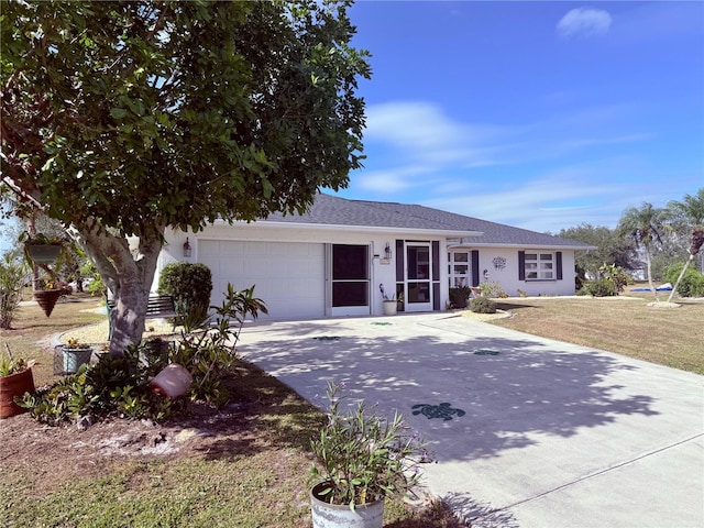 ranch-style home featuring a front yard and a garage