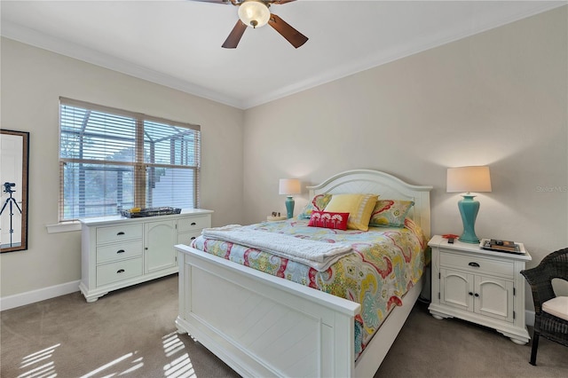 bedroom featuring ceiling fan, carpet, and ornamental molding