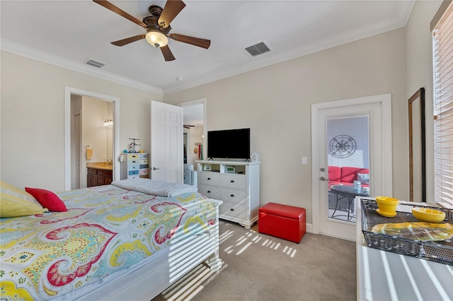 carpeted bedroom with ensuite bathroom, ceiling fan, and crown molding