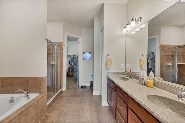 bathroom featuring tile patterned flooring, vanity, and independent shower and bath