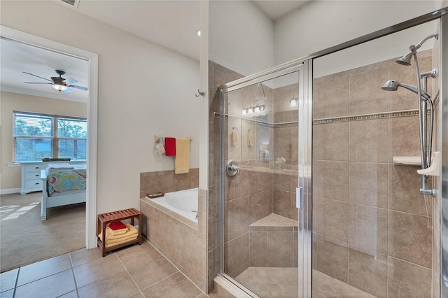 bathroom with tile patterned floors, ceiling fan, and shower with separate bathtub