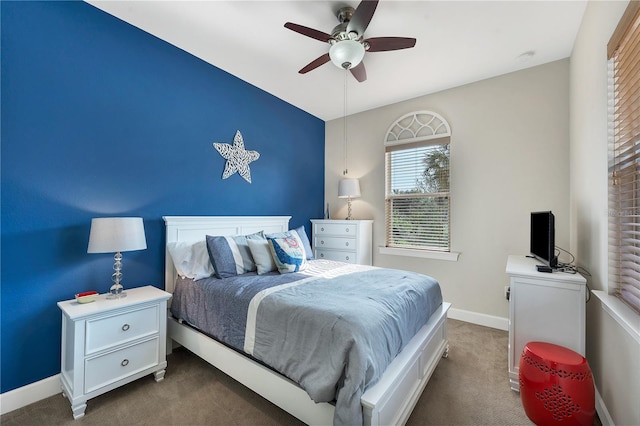 carpeted bedroom featuring ceiling fan