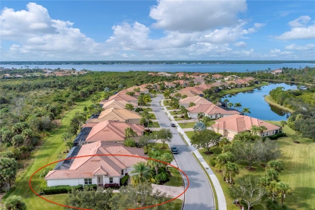 birds eye view of property featuring a water view