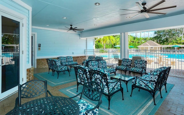 view of patio featuring an outdoor living space and a community pool