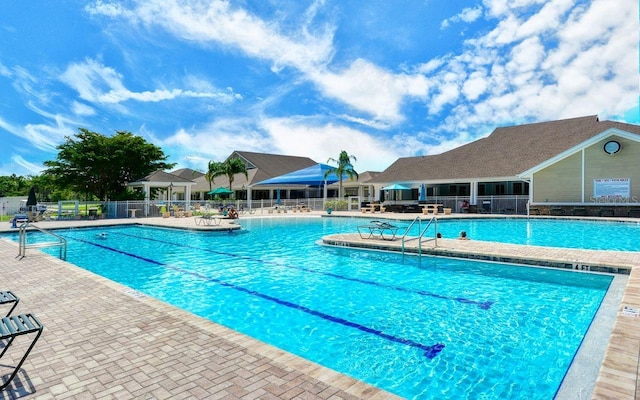 view of swimming pool featuring a patio area