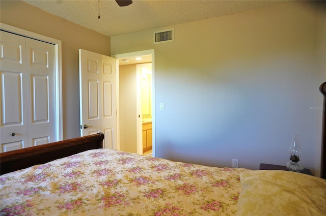 unfurnished bedroom with a textured ceiling, a closet, and ceiling fan