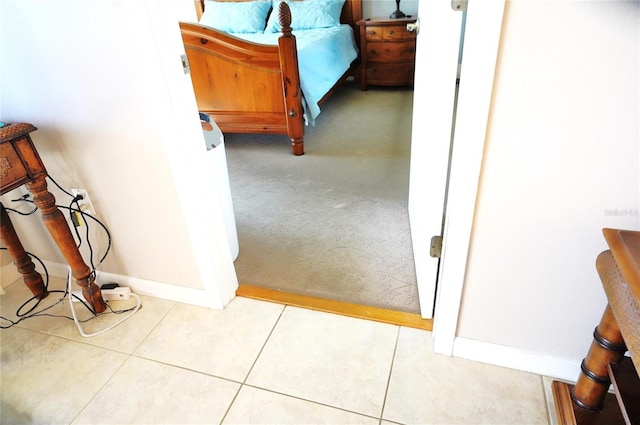 bedroom featuring light tile patterned flooring