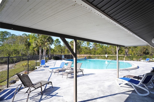 view of swimming pool featuring a patio