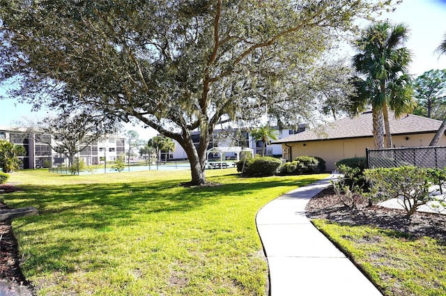 view of home's community featuring a lawn