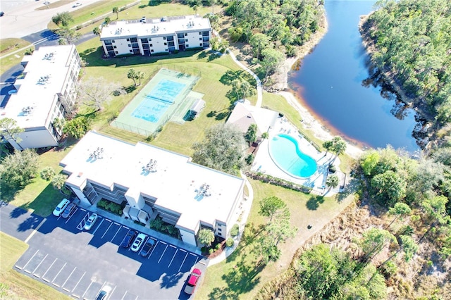 birds eye view of property with a water view