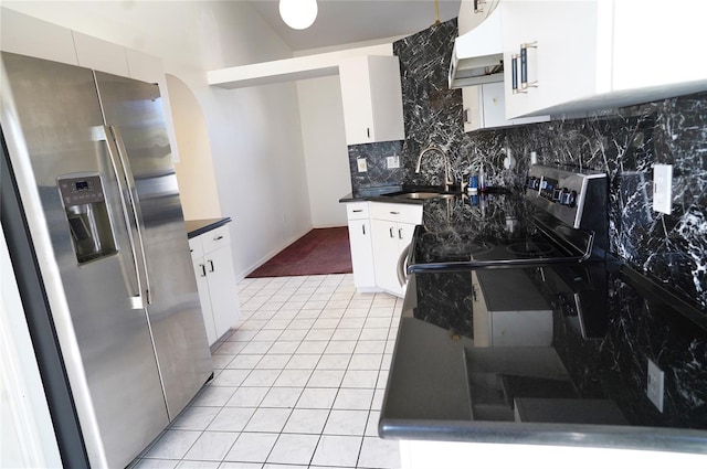 kitchen with sink, backsplash, stainless steel refrigerator with ice dispenser, extractor fan, and white cabinets