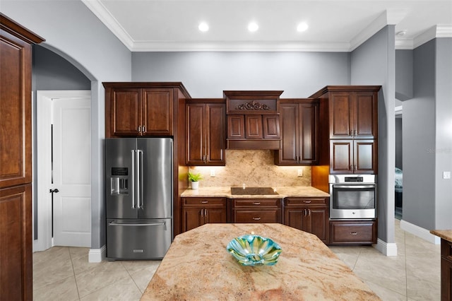 kitchen with crown molding, decorative backsplash, light stone countertops, light tile patterned floors, and stainless steel appliances