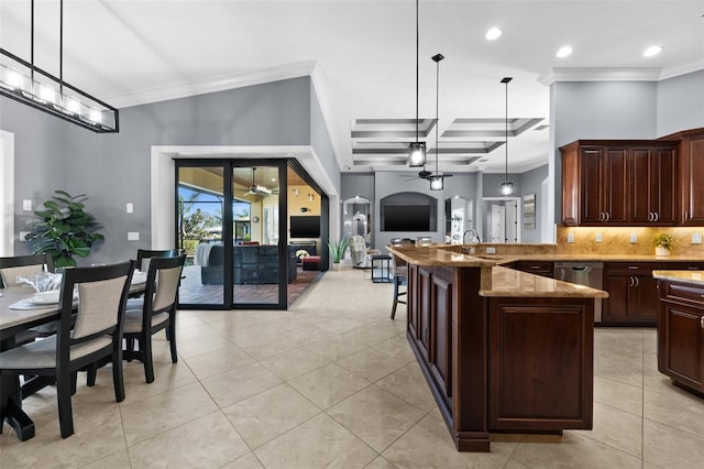 kitchen featuring light stone countertops, coffered ceiling, decorative light fixtures, and ornamental molding