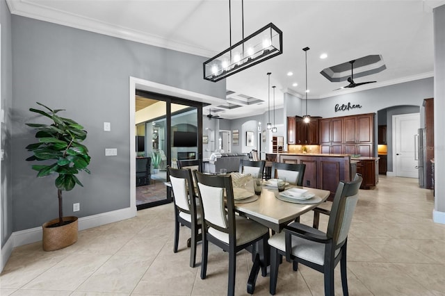 dining space with crown molding, ceiling fan, and light tile patterned flooring