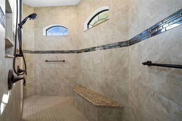 bathroom with tiled shower