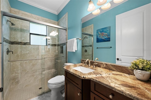 bathroom with vanity, toilet, a shower with shower door, and ornamental molding