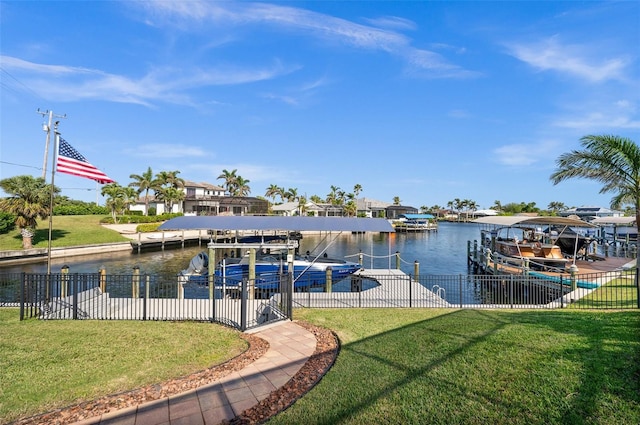 dock area featuring a yard and a water view