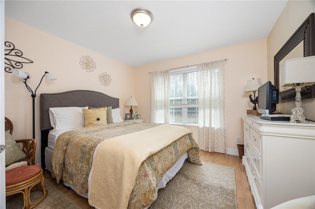 bedroom with light hardwood / wood-style floors