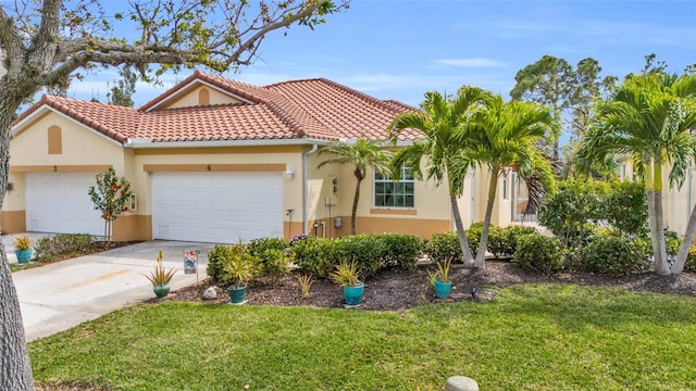 mediterranean / spanish home with a garage and a front lawn