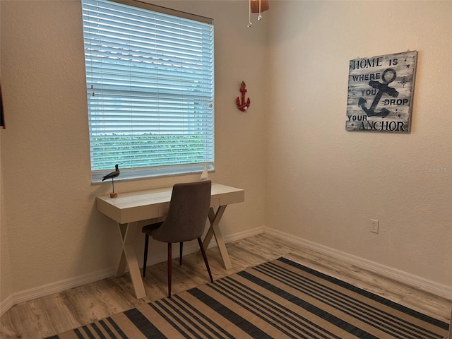 office area with ceiling fan and light wood-type flooring