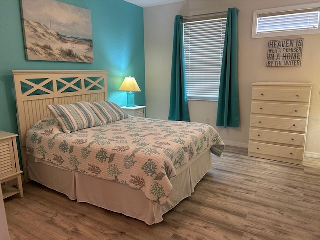 bedroom with hardwood / wood-style floors