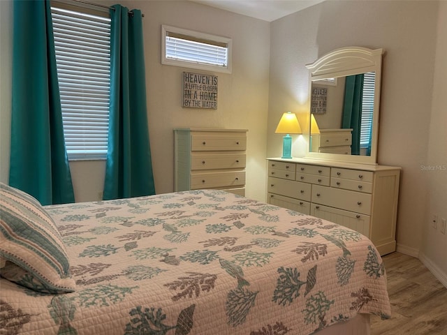 bedroom with light hardwood / wood-style flooring