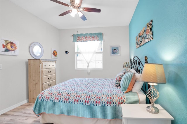 bedroom with ceiling fan and light wood-type flooring