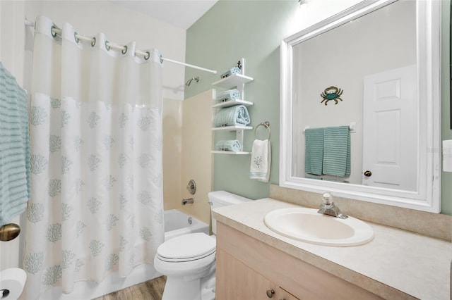 full bathroom with vanity, hardwood / wood-style floors, shower / bathtub combination with curtain, and toilet