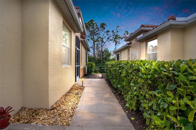 view of property exterior at dusk