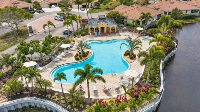 view of swimming pool with a water view