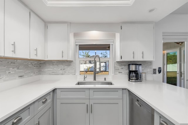 kitchen featuring white cabinets, dishwasher, a healthy amount of sunlight, and sink