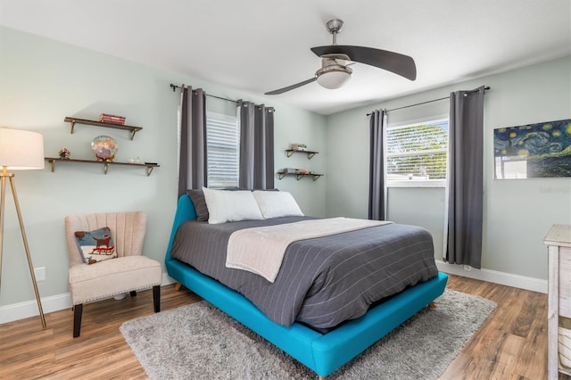 bedroom featuring ceiling fan and wood-type flooring