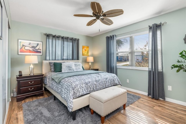 bedroom with ceiling fan and light hardwood / wood-style floors