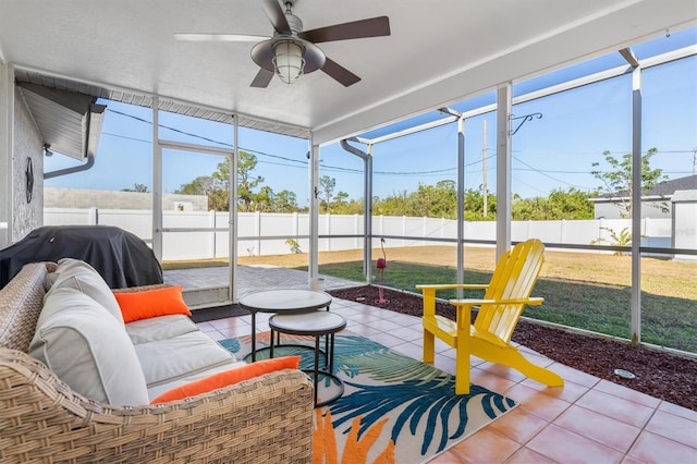 sunroom / solarium featuring ceiling fan and a wealth of natural light