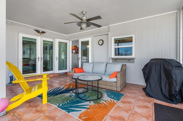 view of patio with french doors, area for grilling, ceiling fan, and outdoor lounge area