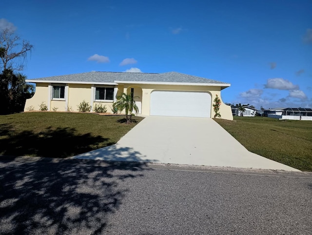 ranch-style house with a garage and a front yard