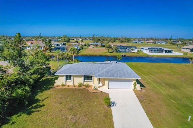 birds eye view of property with a water view