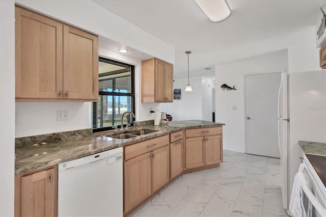 kitchen with light brown cabinetry, white appliances, dark stone counters, decorative light fixtures, and sink